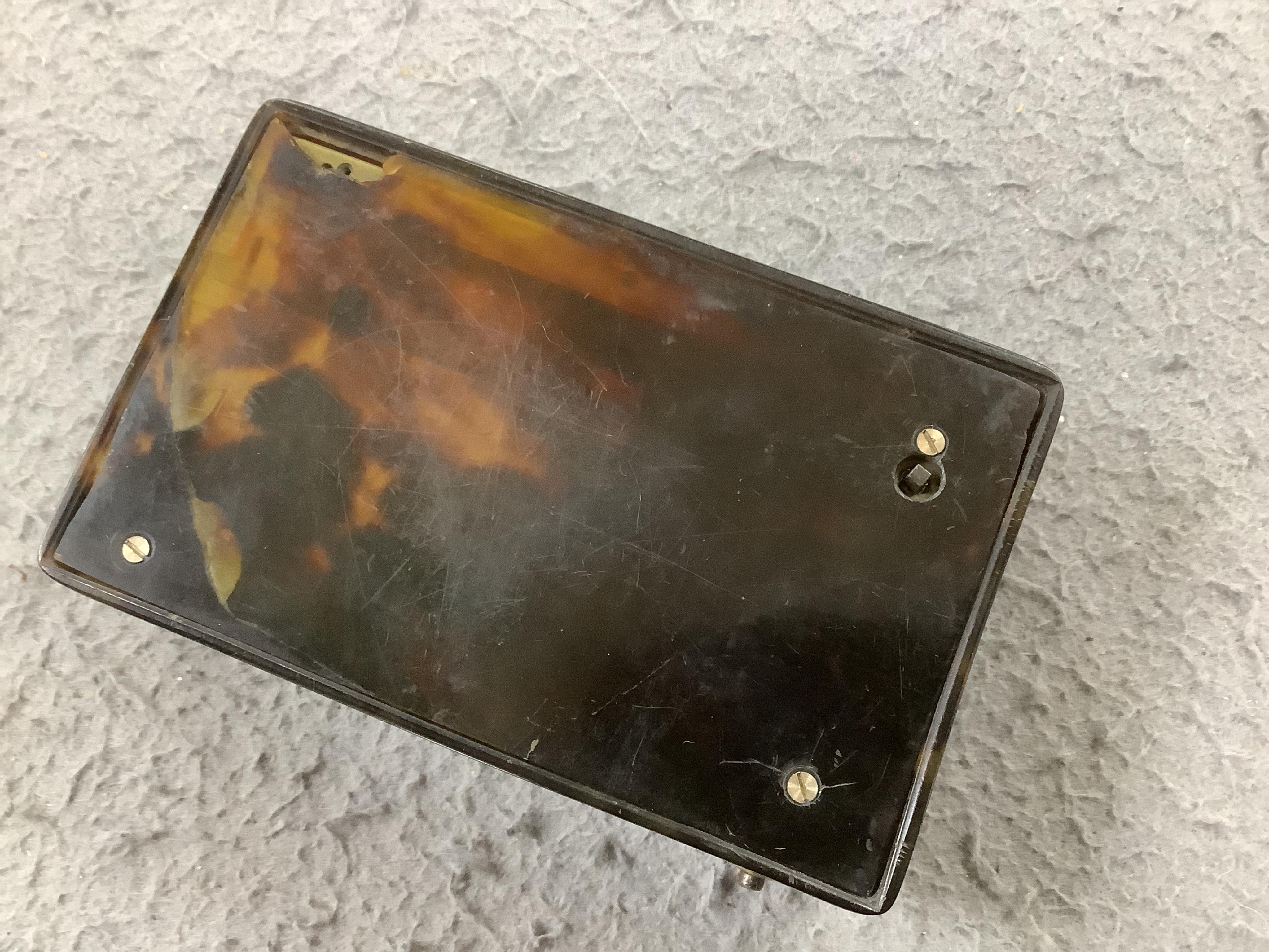 A 19th century tortoiseshell cased musical snuff box, 10cm. Condition - fair